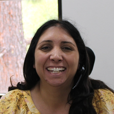 Joanna Smiling In Yellow Shirt With Headset