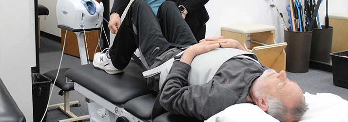 Patient Lying Down In A Spinal Decompression Machine