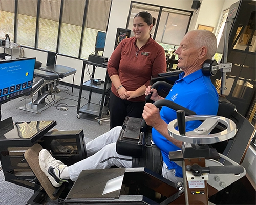 Patient Receiving MedX StrenghteningTherapy With Therapy Assistant