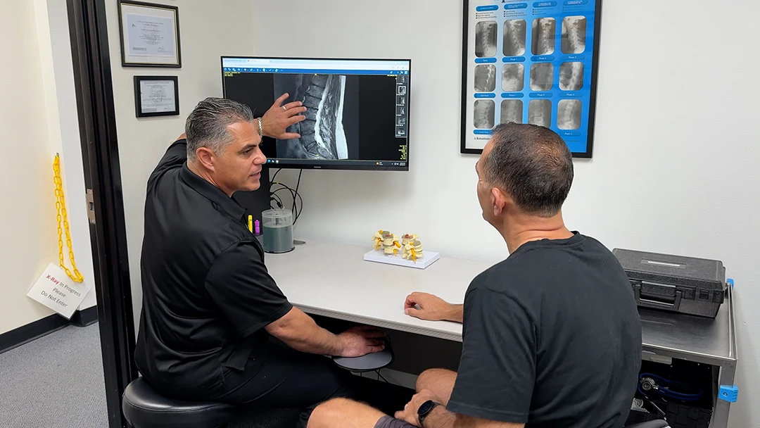 Sevak Khodabakhshian Going Over X Rays with Patient