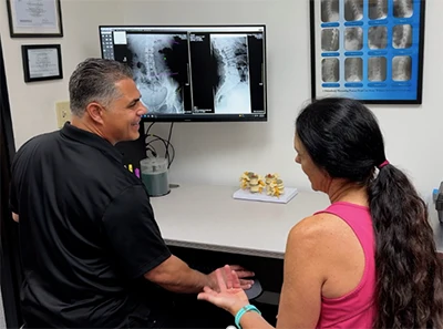 Chiropractor Thousand Oaks CA Sevak Khodabakhshian Going Over XRays